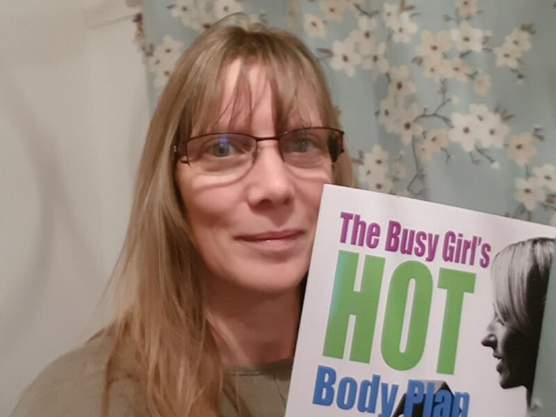 Jodie holding The Busy Girl’s HOT Body Plan book